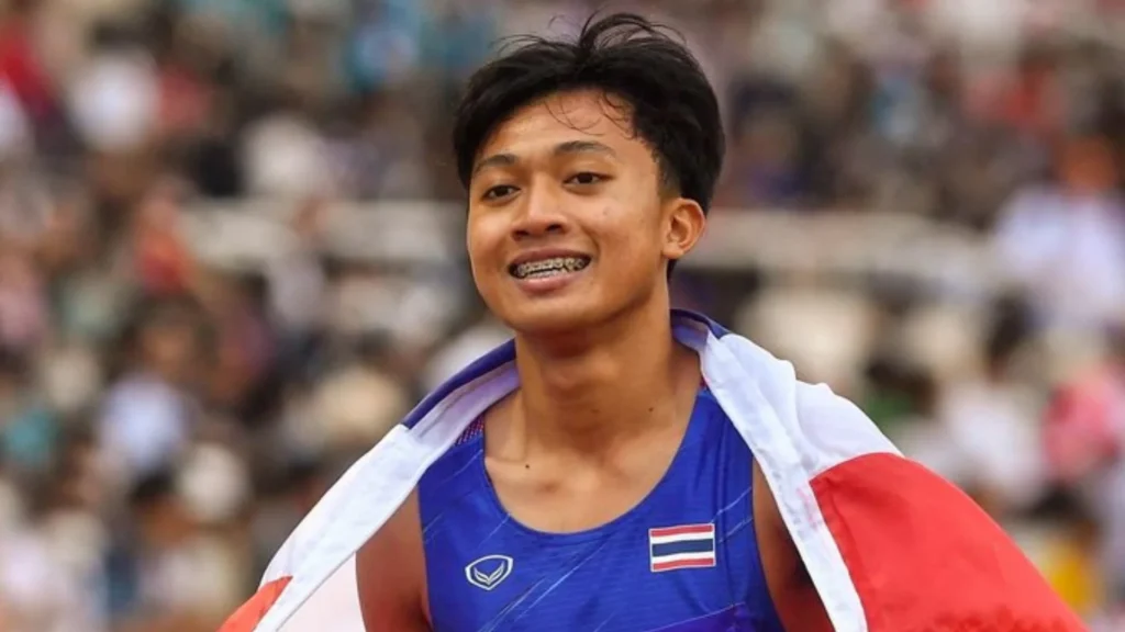Puripol Boonson celebrates his 100m gold medal at the Asian Games 2026 after running 9.90 seconds
